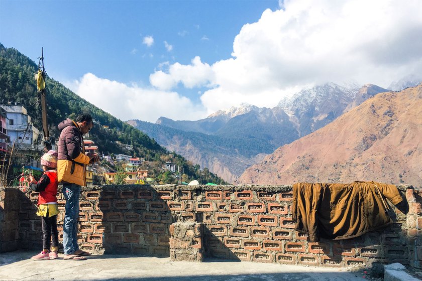 Raghav and Ayesha on the terrace of their home.  'I want to come again to sit in the sun on my roof and watch the mountains'.