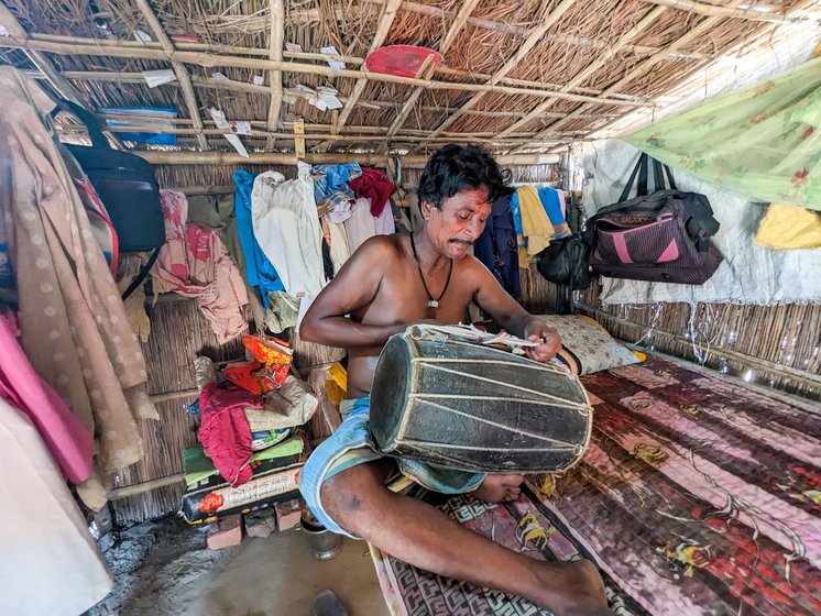 After a performance, the musician loosens the leather ropes on his dholak and hangs it back on the wall.