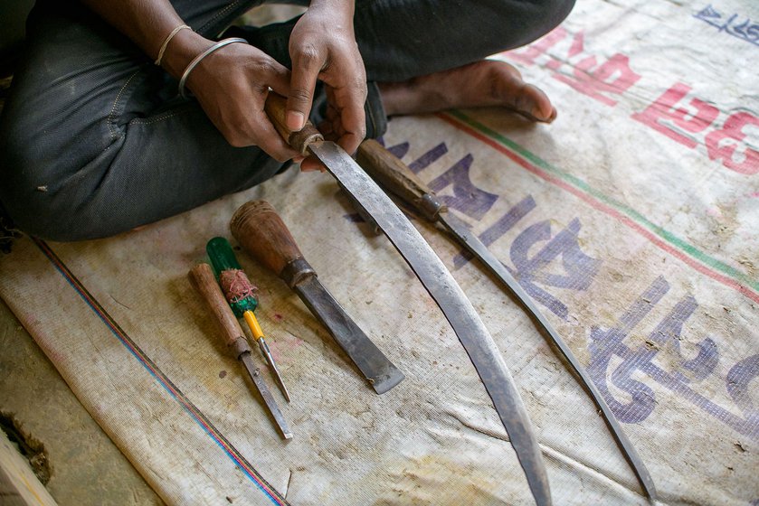 Left: The curved dao blade, two different botalis (flat-edged chisels) and a screwdriver used like an awl are some of the tools used by the craftsmen.