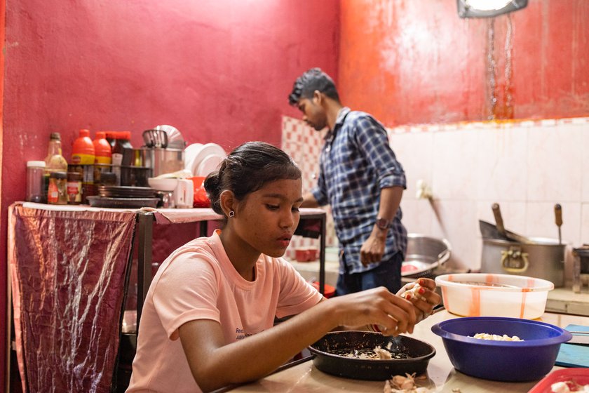 'I'm known to have one of the cleanest kitchens in Majuli,' says Biman. Right: His young cousin often comes to help out at the eatery