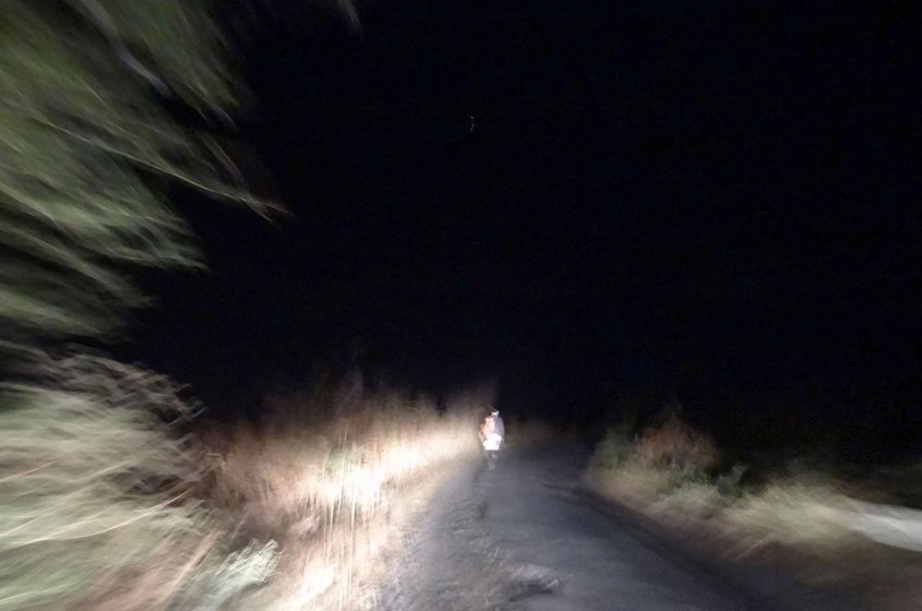 Right: A farmer walks to his farm as night falls, ready to stay on guard