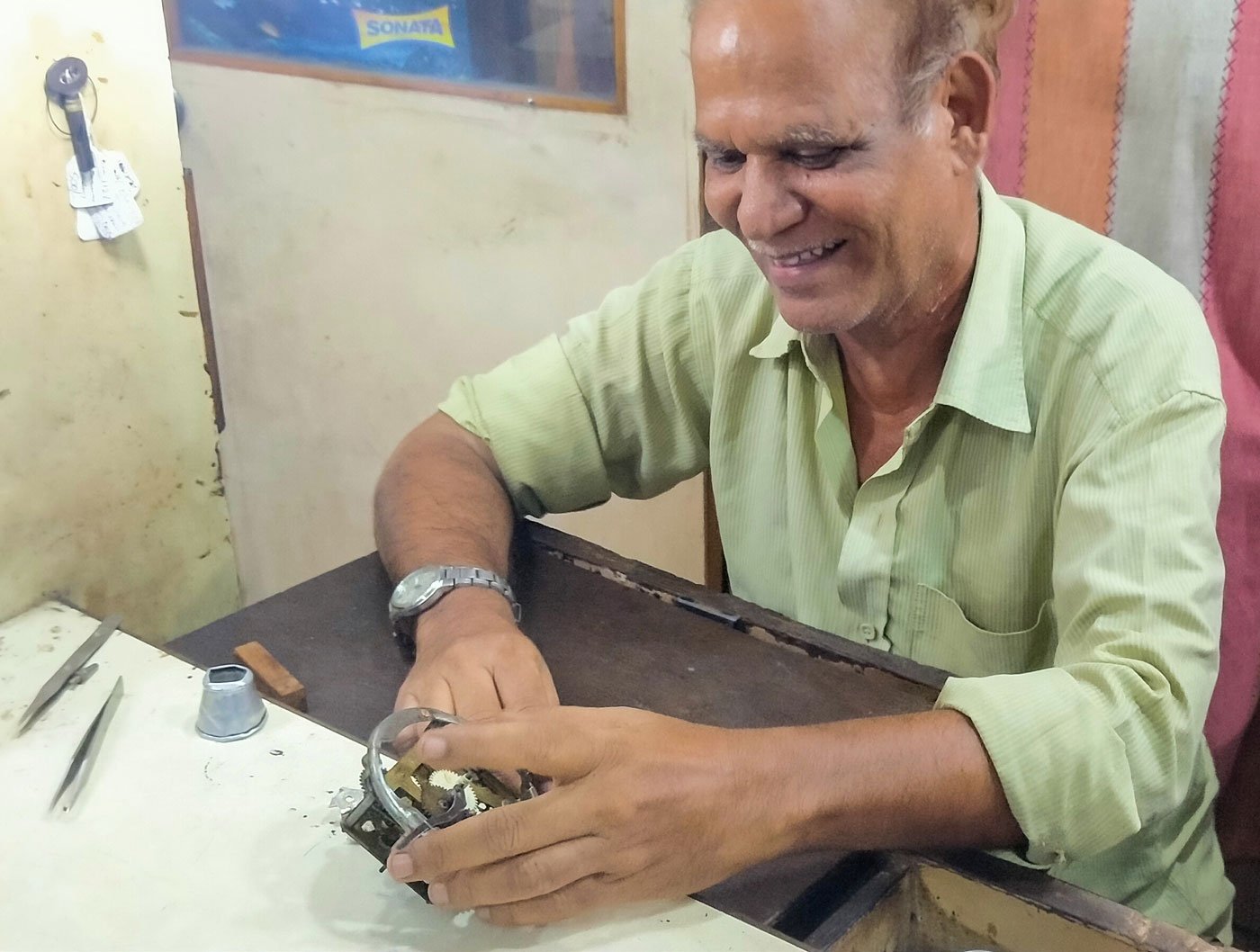'Even before the coronavirus, I had very few watches to repair. Now it's one or two a week', says Habibur, who specialises in vintage timepieces (left)