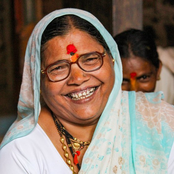 Sulabai Ravishankar Jadhav, the lead singer of the group, explains the rhythms of the songs and ensures synchrony as the other singers join her