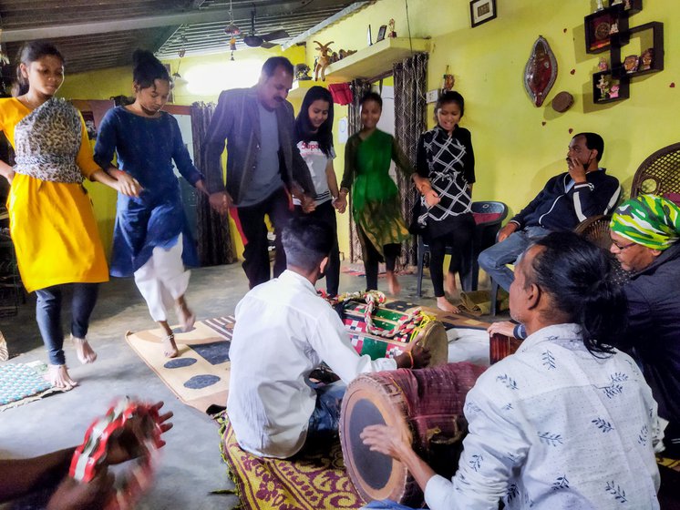 Durga Prasad Das instructing his band during a practice session.