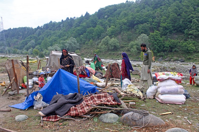 Shakeel Ahmad (left) enjoying lunch on a sunny afternoon in Wayil, Ganderbal with his wife Tazeeb Bano, and daughters Nazia and Rutba. The wait is finally over and the family are packing up to move into the higher Himalayas.