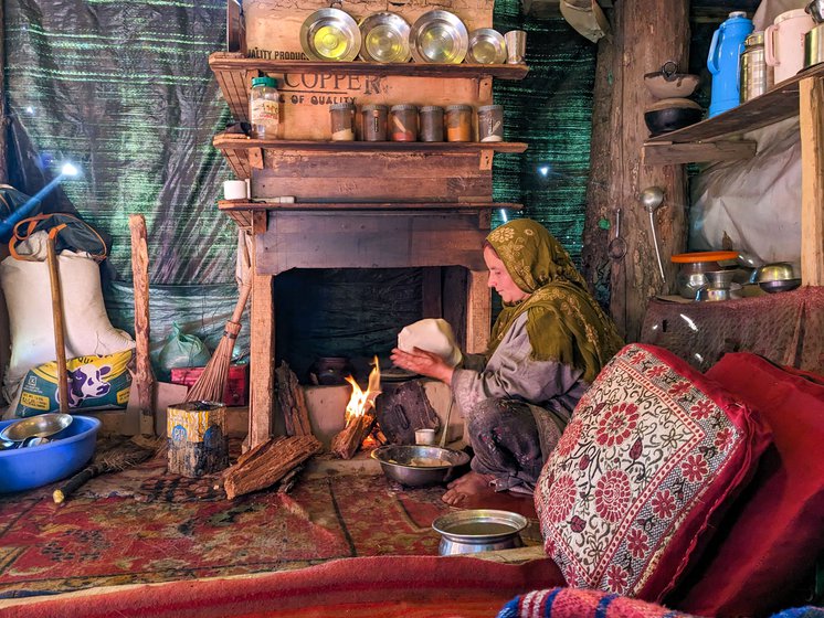 Salima Sheikh preparing noon chai (a traditional Kashmiri drink of green tea leaves, baking soda and salt) and rotis