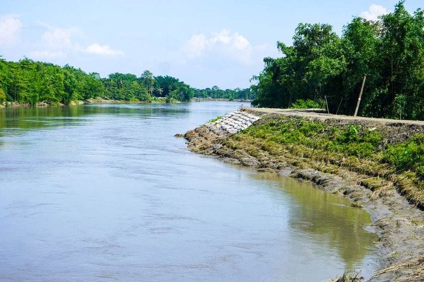 Right: Sandbags used to uphold the weaker parts of the embankment where it broke and villages were flooded in 2021.