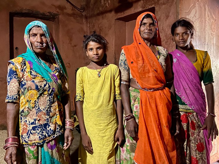 Gopli with two of her four children and her mother-in-law