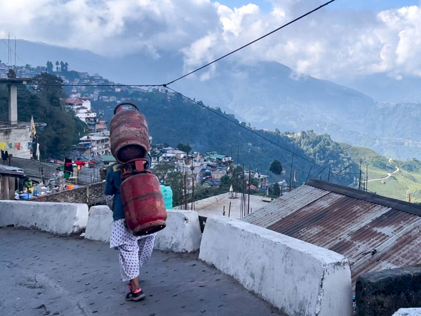 'Until [my children] Bhawana and Bhawin finish studying, I will carry cylinders,' says Maya Thami