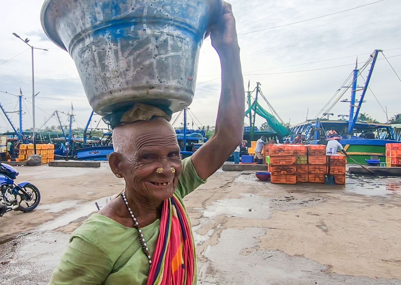 She is at the harbour from 4 a.m. to 6 p.m. – salting, packing selling. The kazhar is salted on the first day to reduce its smell. On the second day it’s dried and packed in mesh bags, which she purchases at the harbour for Rs. 4 each, and sometimes she reuses the jute salt-sacks that cost Rs. 15 each.

One bag of kazhar weighs 25 kilos, says Puli. Earlier, she could sell 4-5 bags a week, but with the Covid-19 pandemic, as well as a ban on ring seine nets, the scale of fish catch and trade has gone down. She now manages to sell two bags a week to to buyers from Namakkal. This brings her a weekly income of about Rs. 1,250.

Women engaged in all tasks – auctioneers, vendors, those drying fish or sorting kazhar – at the Cuddalore harbour speak of the uncertainties of their daily income. Many younger women in the fishing villages prefer to stay away from fisheries. As a result, usually older women work at the harbour.