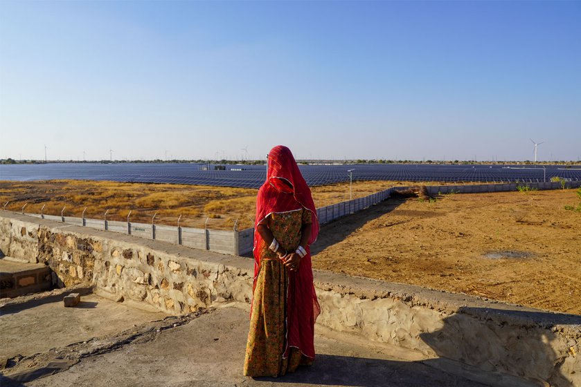 Left: Windmills and solar farms stretch for miles here in Jaisalmer district.