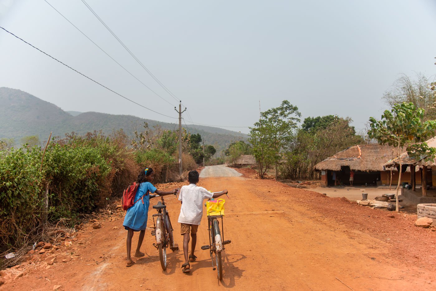 It is 1 p.m. and Jhilli Dehuri, a Class 7 student and her schoolmate, are pushing their cycles home to Barabanki. She is often sick from the long and tiring journey, and so is not able to attend school regularly