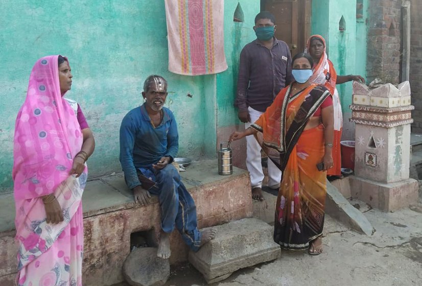 ASHAs – like Suvarna Bhoj (left) and Tanuja Waghole (holding the tiffin) – are the 'first repsonders' in a heath crisis in rural areas