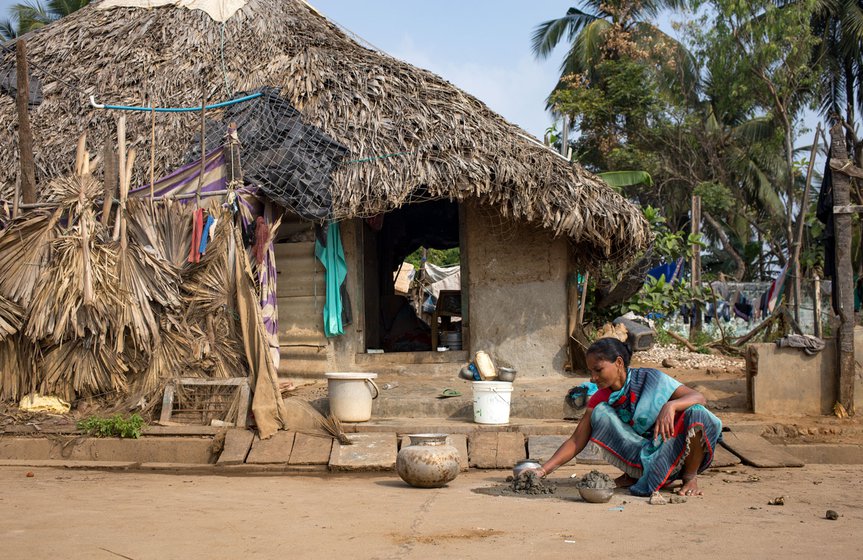 M. Poleshwari outside her third house; the first two were lost to the sea. “We take debts again and the house gets submerged again”