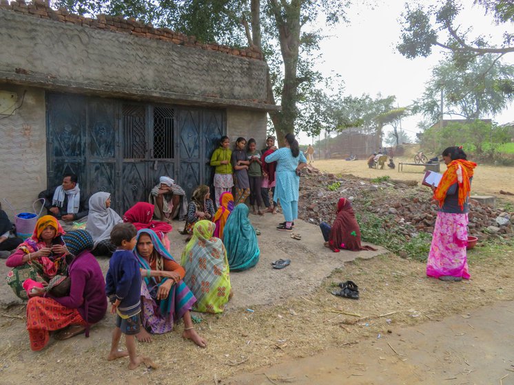 Right: Teena speaking to young girls