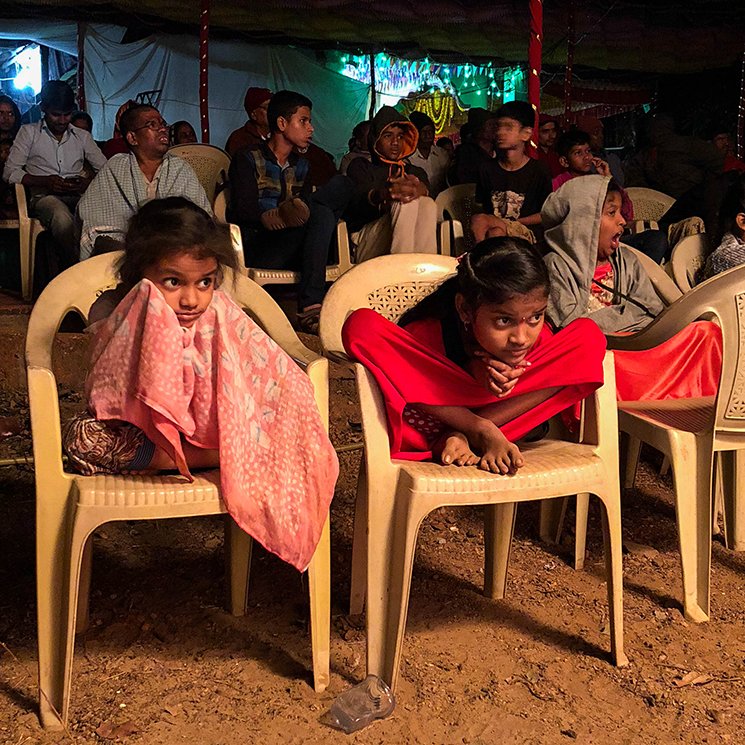 young girls stay awake to watch the play 