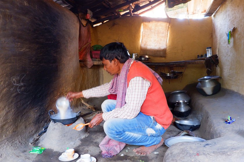 Left: Vijay Chitrakar making tea inside his home.