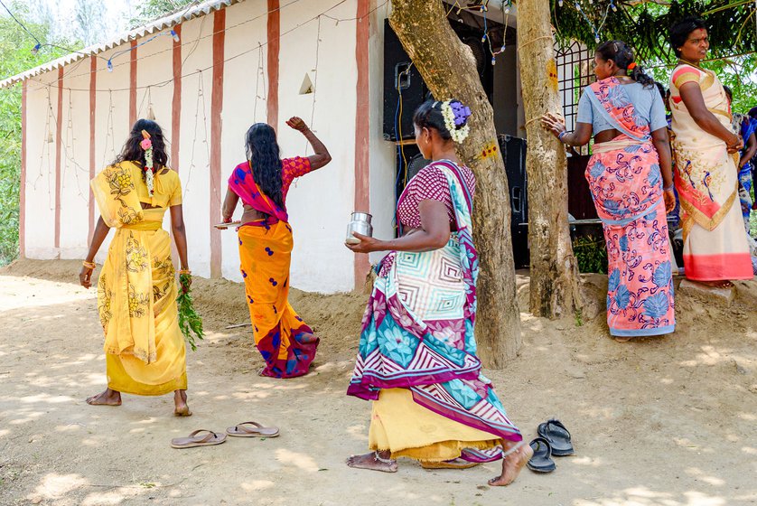 They are throwing it around (right) as part of a purification ritual around the village