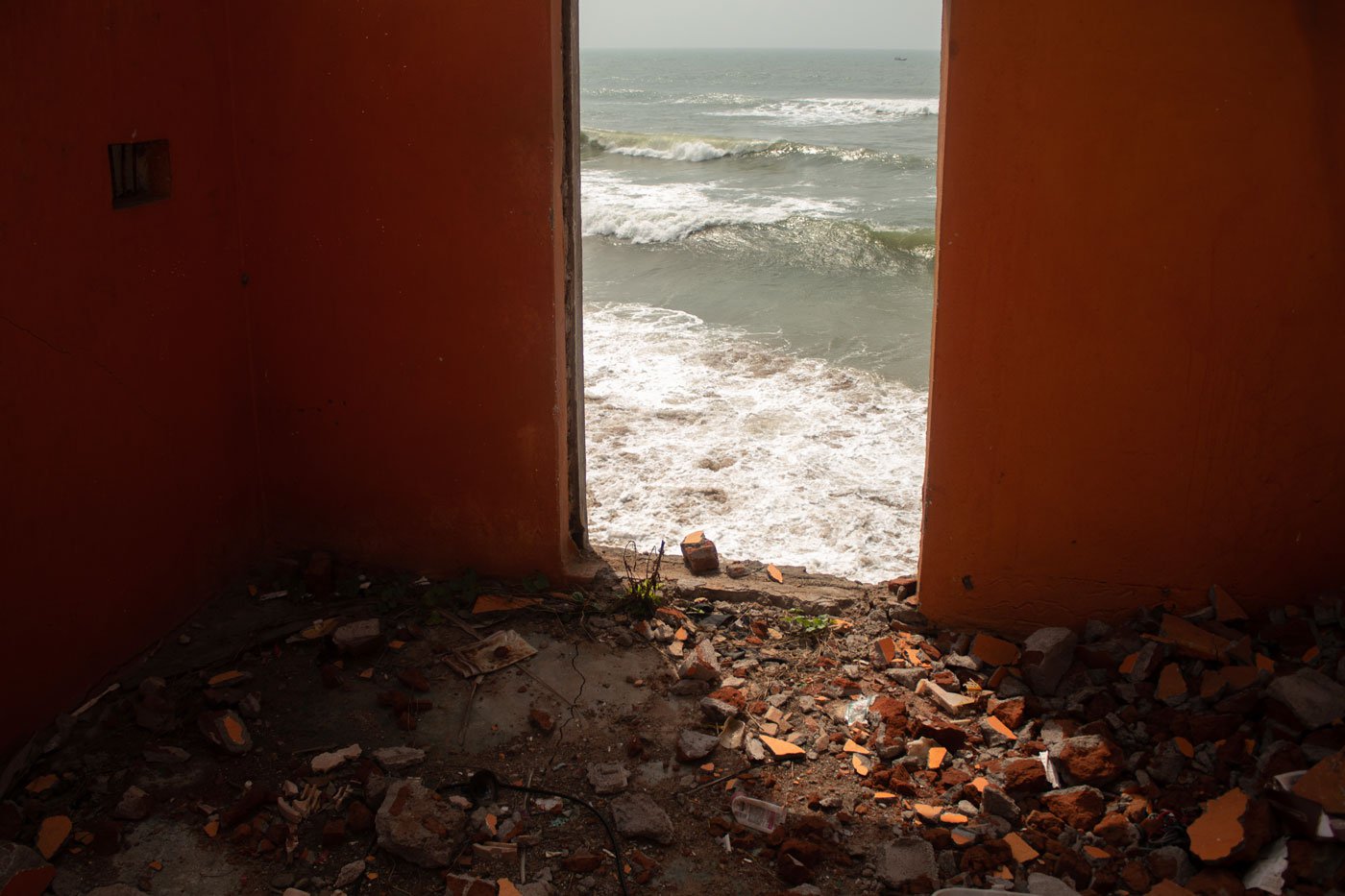 In Podampeta, a house damaged due to sea erosion is no longer livable.