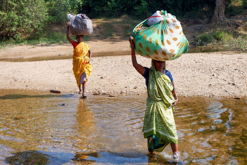 Carrying the loads on their heads, the two women walk for around 30 minutes to get to the station. The slow passenger train will take three hours to cover a distance of 44 kilometres. 'A whole day wasted on the journey alone,' Sakuni says