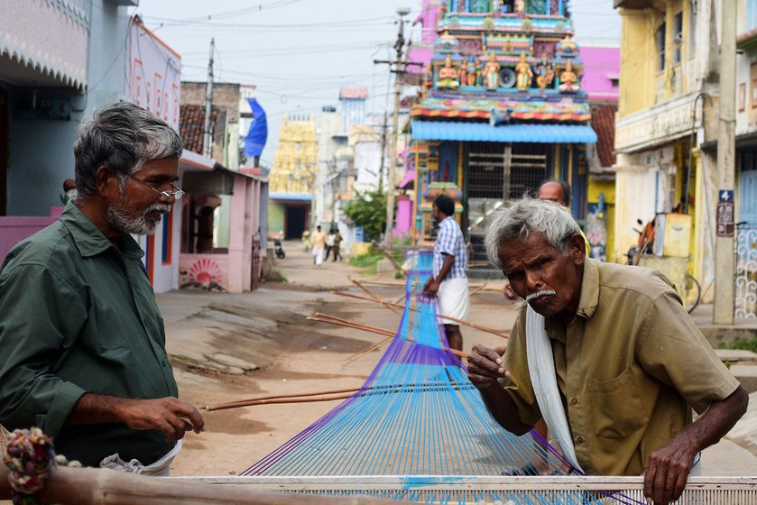 Manonmani Punnakodi and her family members prepare the warp early in the morning. The loom is washed with rice water. The starchy water helps separate the threads quickly and crisply. They are separated to a particular count for the loom