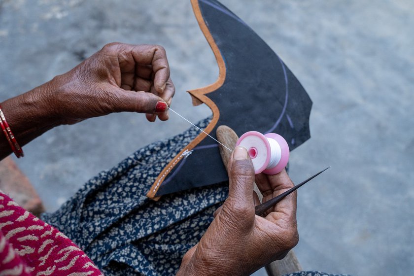 It takes her about an hour to embroider one pair. She uses sharp needles that can pierce her fingers if she is not careful, Veerpal says