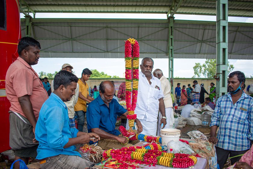 Ramachandran holds up (left) a freshly-made rose petal garland, the making of which is both intricate and expensive as he explains (right)