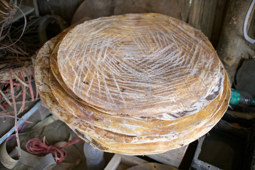 Procuring skins for leather has become difficult these days, craftsmen say. Rolls of leather and a set of khols awaiting repairs are stored in one corner of the shop