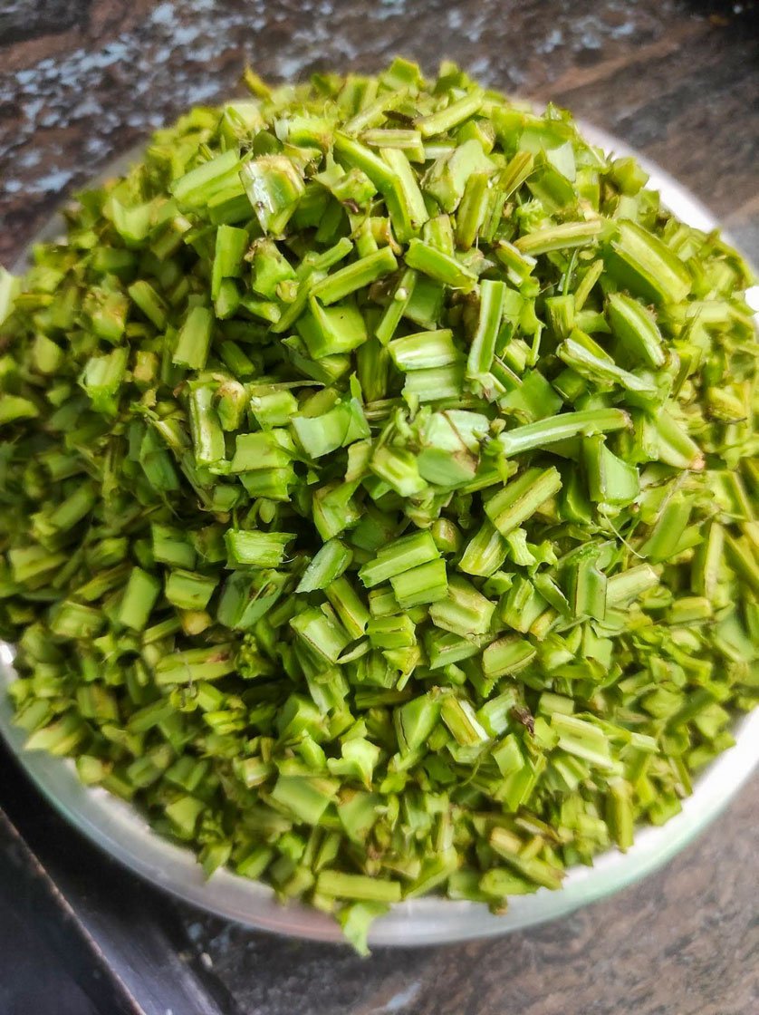 Cleaning and cutting up the shoots for making pirandai pickle