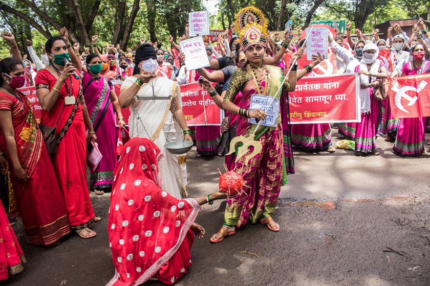 An ASHA dressed as Durga (left) during a protest outside the Collector’s office (right) in Kolhapur. Across India, ASHA workers have been demanding better working conditions, employee status, monthly salary and timely pay among other things