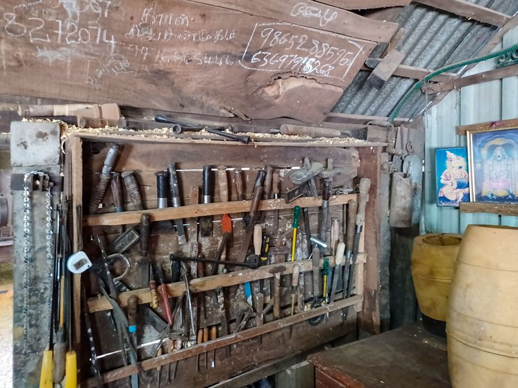 Kuppusami’s workshop stacked with blades, saw, spanners, lumber and machinery