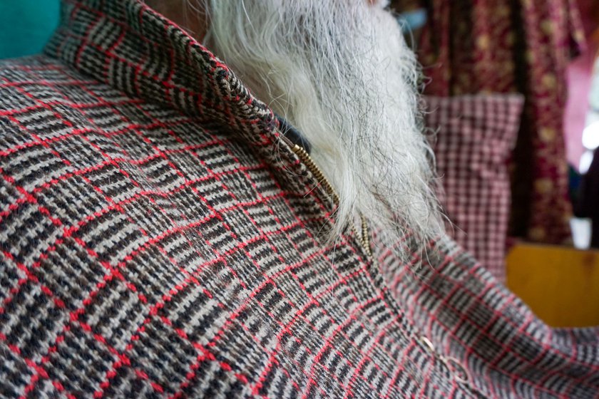 Left: Ghulam Qadir wears a charkhana patterned pheran, a gown-like upper garment.