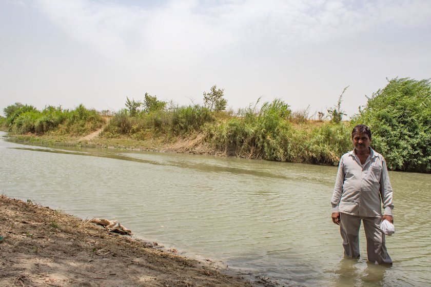 Left: Shivram Saxena standing knee-deep in the Sai river.