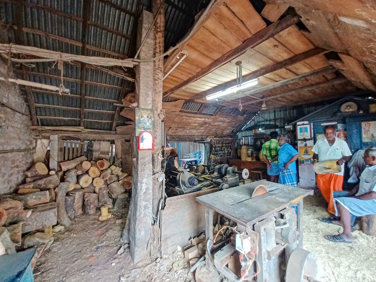 Kuppusami’s workshop stacked with blades, saw, spanners, lumber and machinery