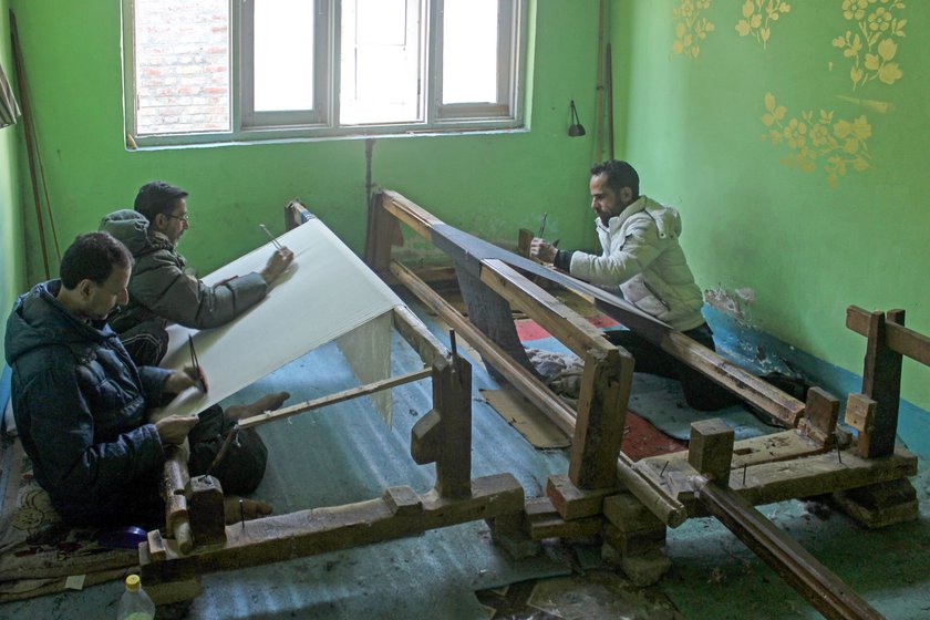 If a shawl is bigger than the standard 40 x 80 inches, two purazgars work on it together on a loom