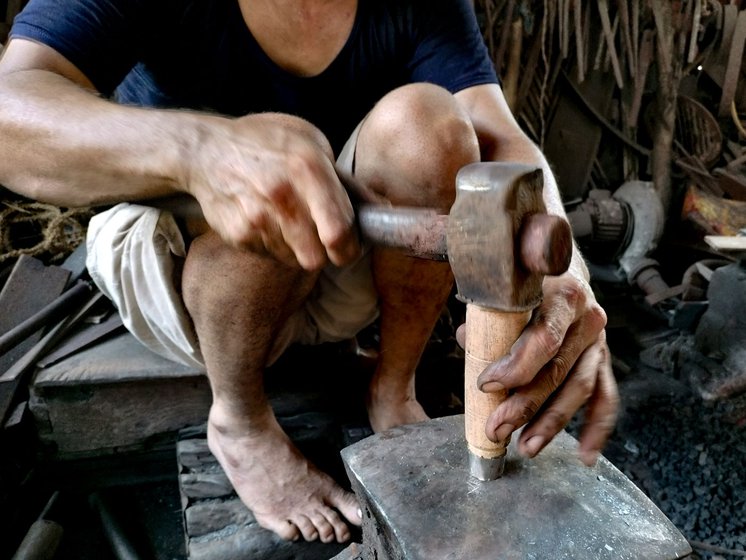 The last step is to attach the maandal (steel circular ring) and wooden base to it (right)