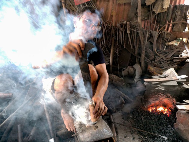 The lohar adds final touches to the sickle (left) and puts it inside the forge (right)