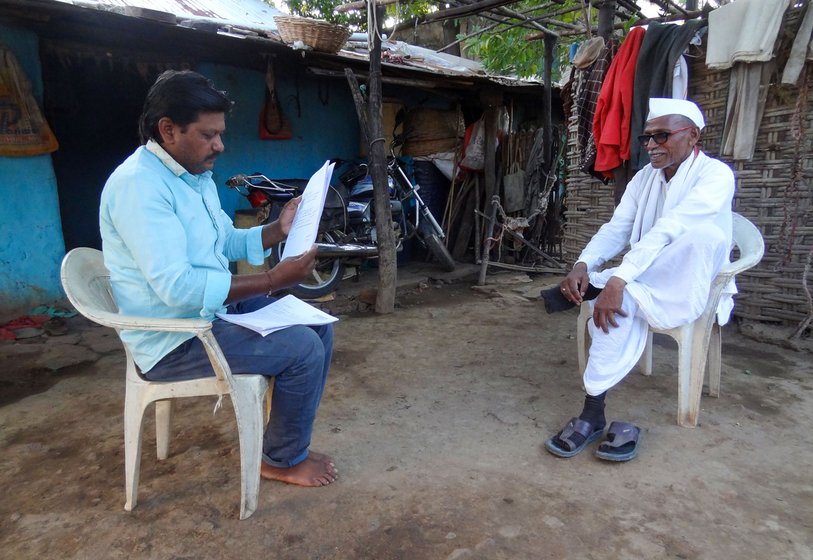 Gopal Bonde (right) with Vitthal Badkhal (middle) who has been trying to mobilise farmers on the issue. Bonde filed compensation claims about 25 times in 2022 after wild animals damaged his farm.