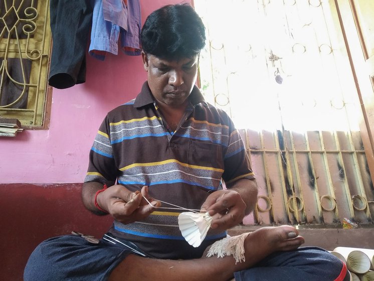 Left: After the feathers are grafted onto the cork bases, it takes the preliminary shape of a shuttle. Tarakh Koyal then knots each overlapping feather with a thread interspersed with double twists between shafts to bind it .