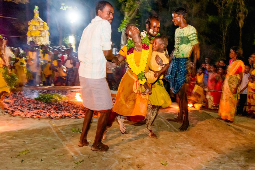 Right: It is an emotional moment for many who have kept their vow and walked on fire