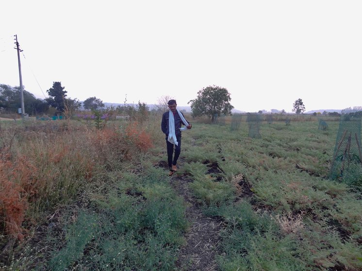 Ramchandra Dodake (right) at the break of the dawn, on his farm after the night vigil