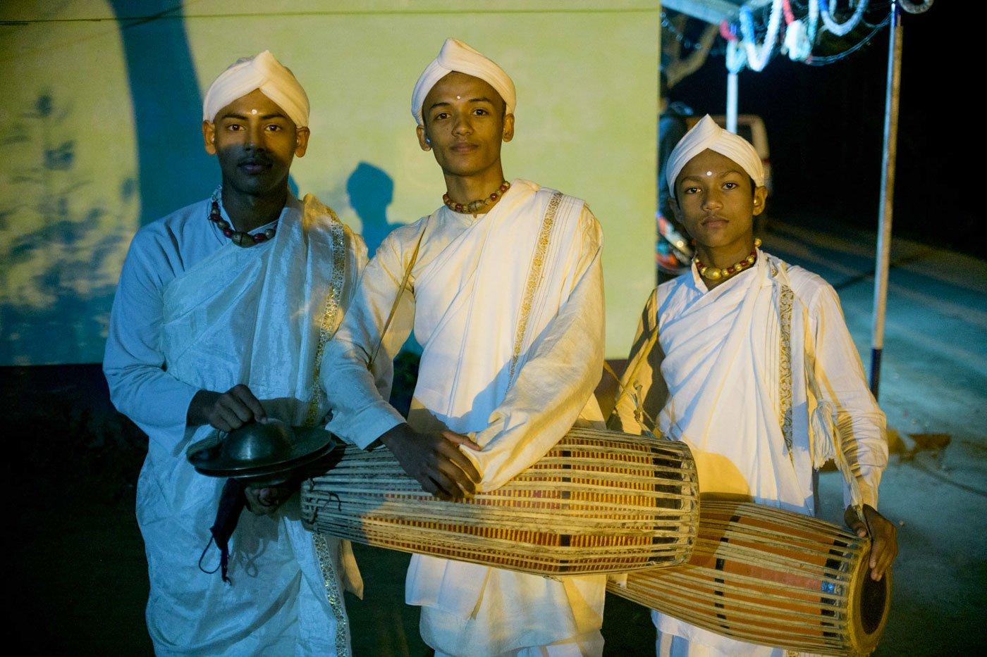 Subhashish Borah, Priyabrat Hazarika and Jyotishman Dutta pose for a portrait in traditional attire