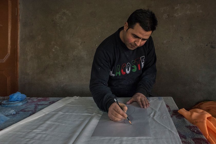 Shabir Butt, now in his mid-30s, learnt to make designs on pashmina shawls from his father, and has been in the trade since he was 15. Though the drawings are now computerised in many places, he prefers to continue drawing by hand.