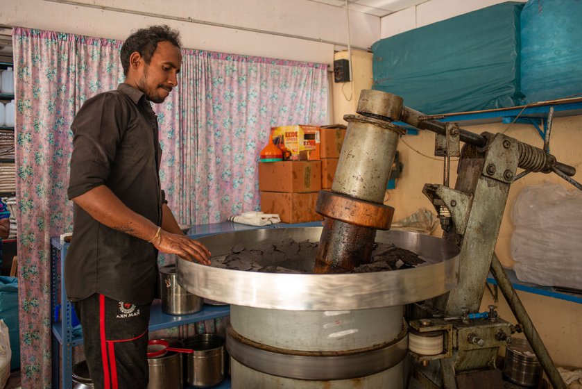 The wooden press at Srirangam squeezes the golden yellow oil out of the sesame seeds