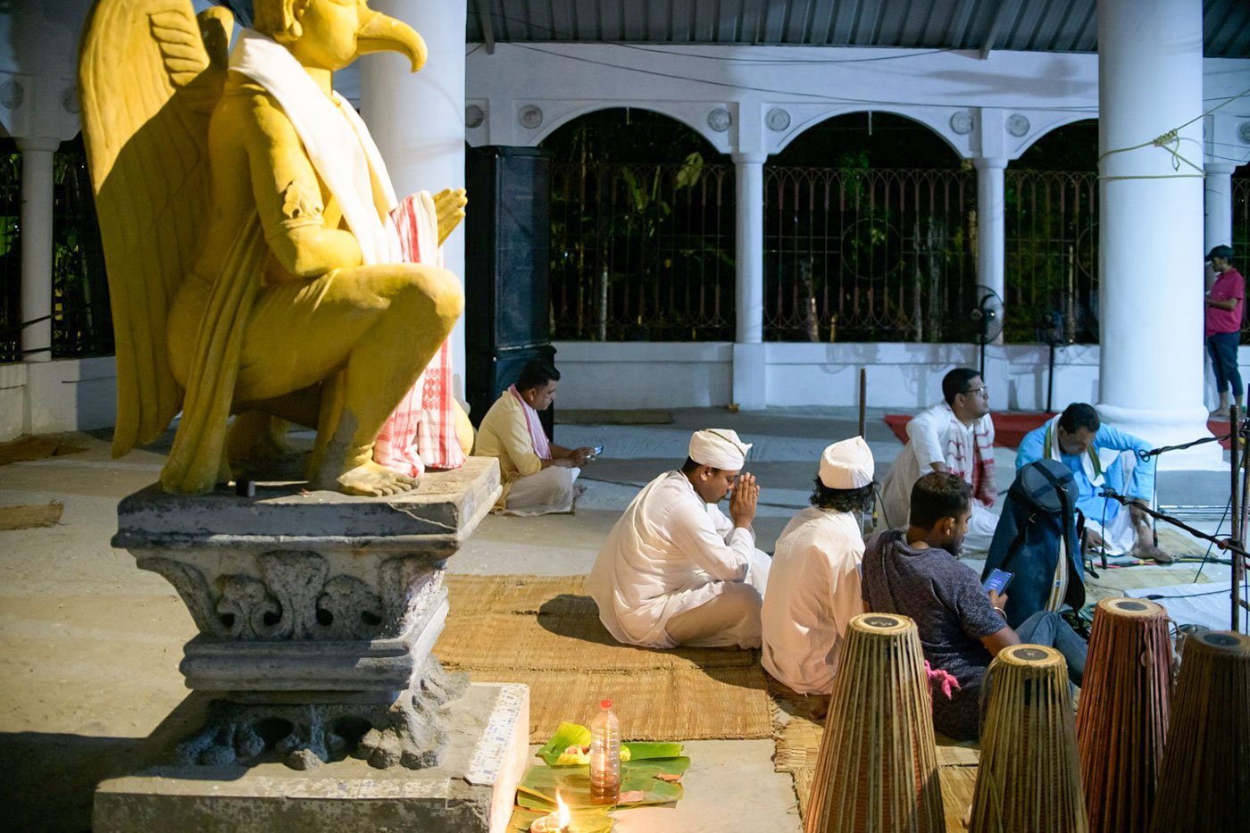 Samudra Hazarika offers a prayer during the performance of the Nri Simha Jatra Bhaona in the namghar of the Garamur Saru Satra