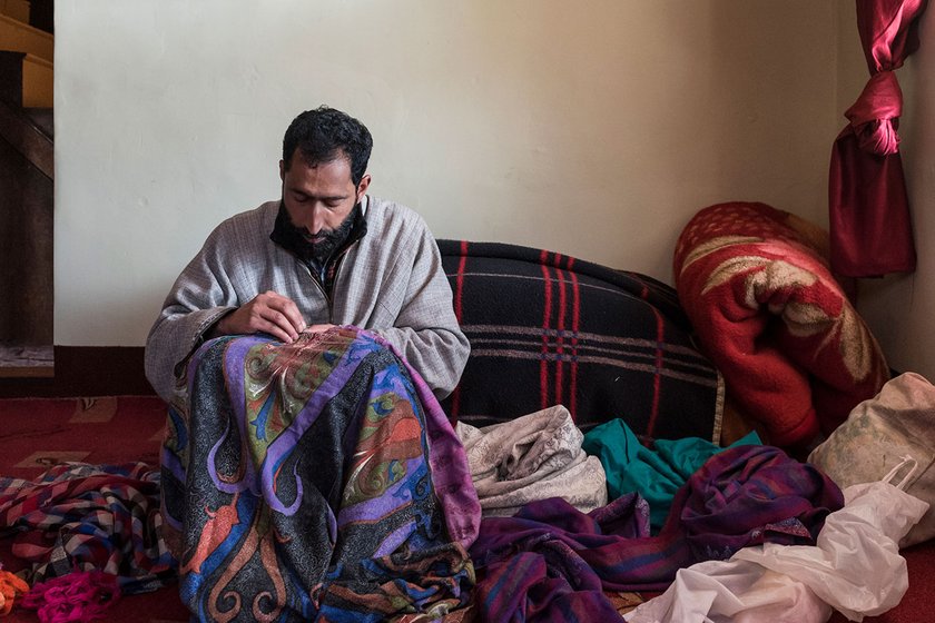 Nazir Ahmed, a master artisan, embroidering a pashmina shawl with his sui-dhaga  in Ganderbal.  A shawl fully covered with designs can take even up to 6-8 months, while a plain one with an ornate border might take a month at most. 