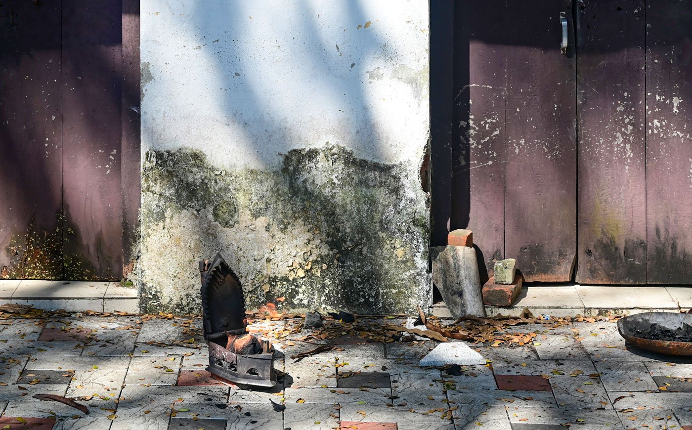 The traditional box iron is a companion of the dhobis . Charcoal inside the box has to be burned to heat it before ironing