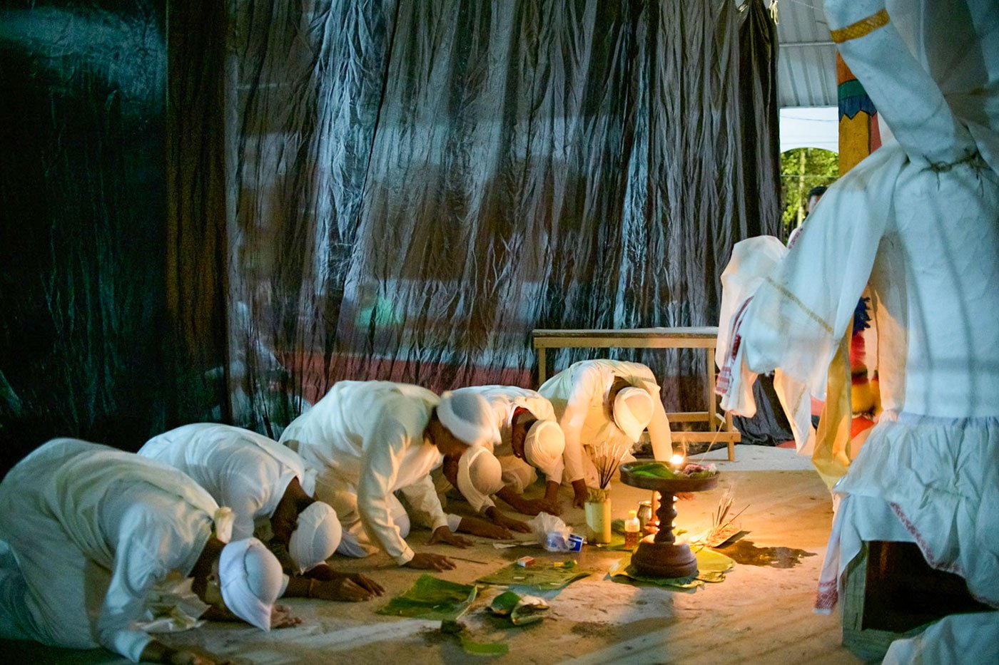 The group prays to the Nri Simha mask before their performance