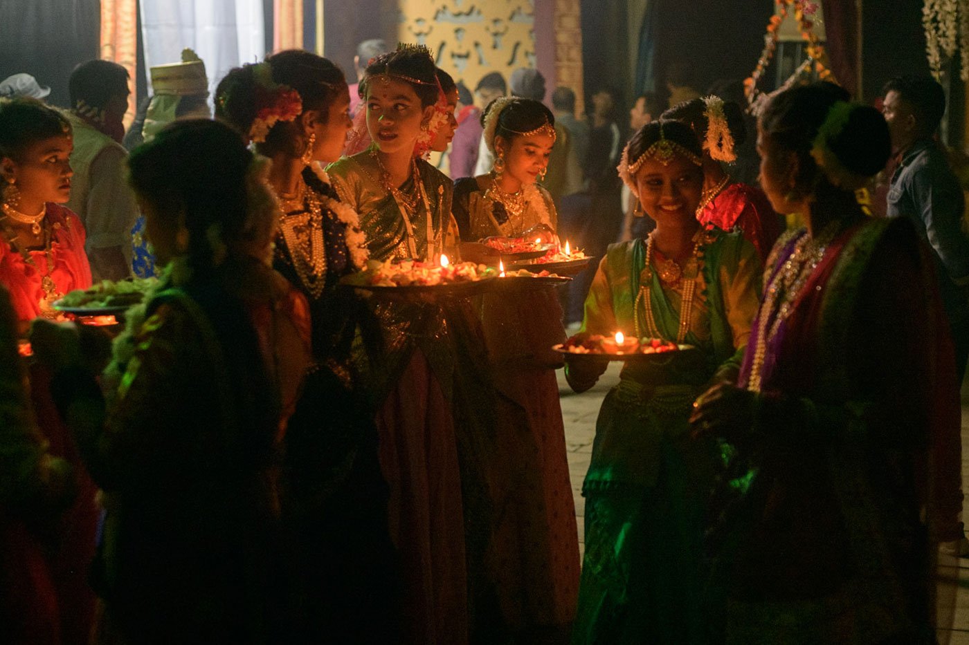 Young women dressed as gopis (female cowherds) prepare backstage for the nandotsav scene where the people of Vrindavan celebrate the birth of Krishna