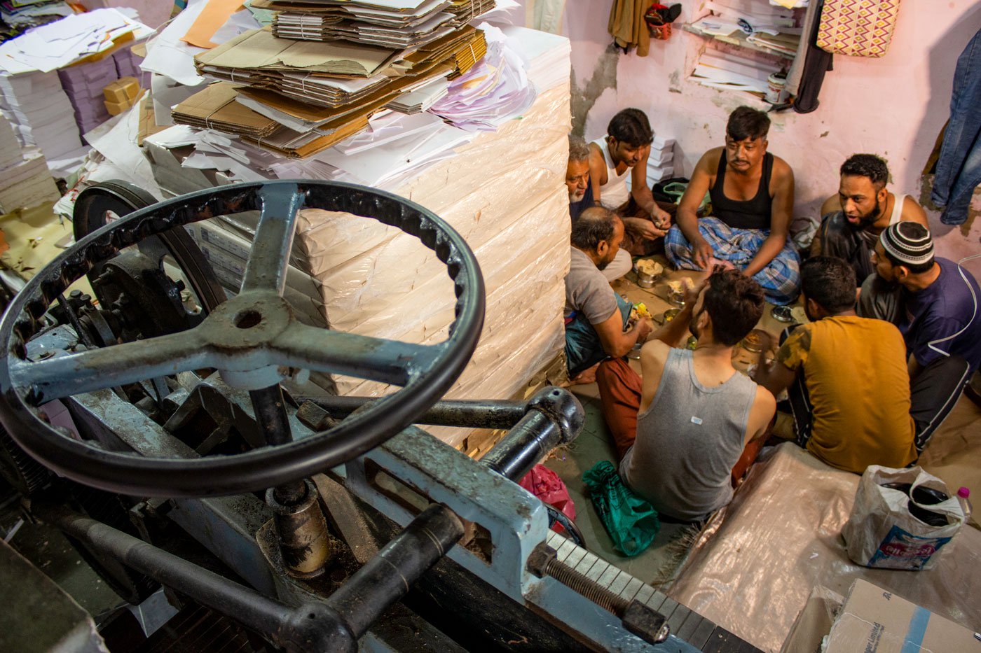 Artisans at Om Traders taking a break for lunch. This is the only time in the day that they stop working